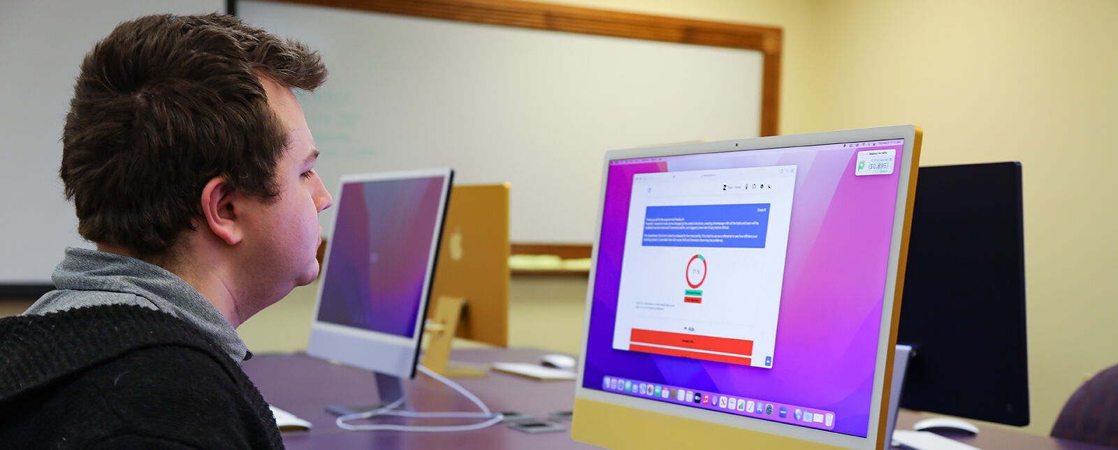 An IT worker works at a computer