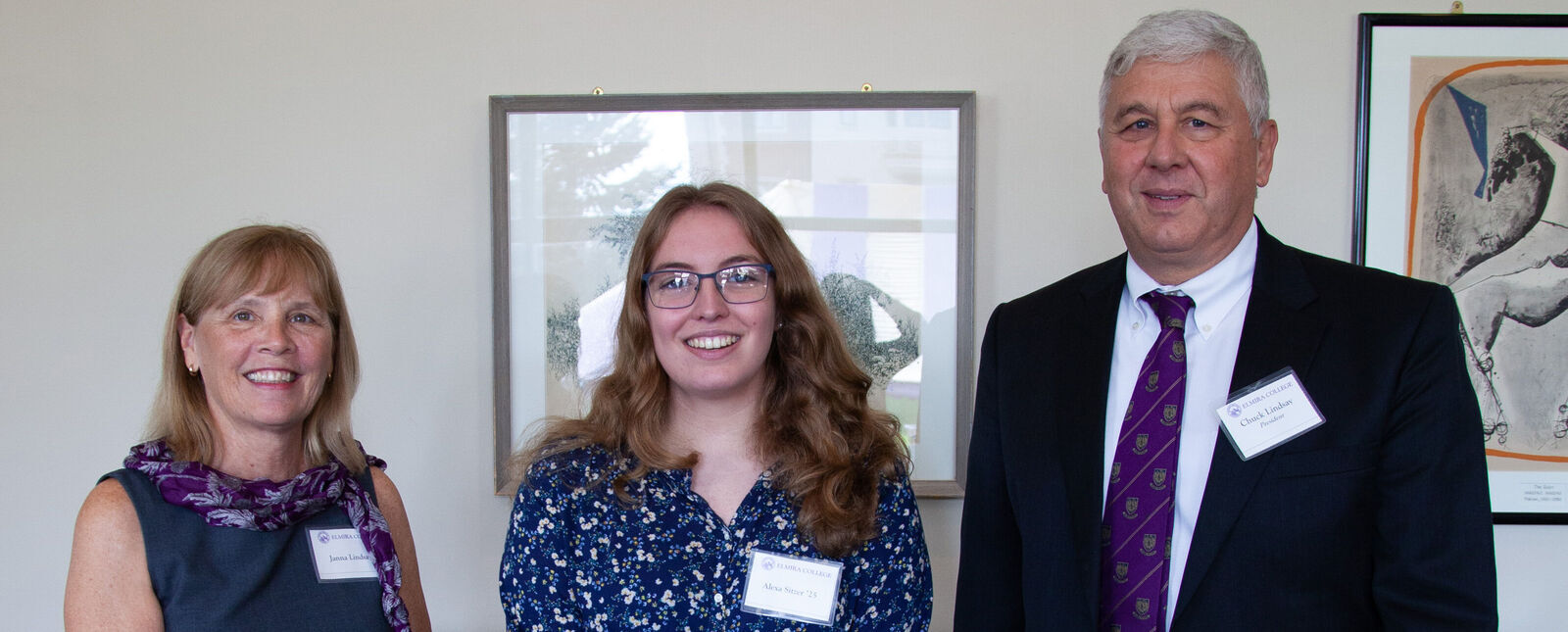 President and Mrs. Lindsay stand with Alexa Sitzer during the Key Award celebration