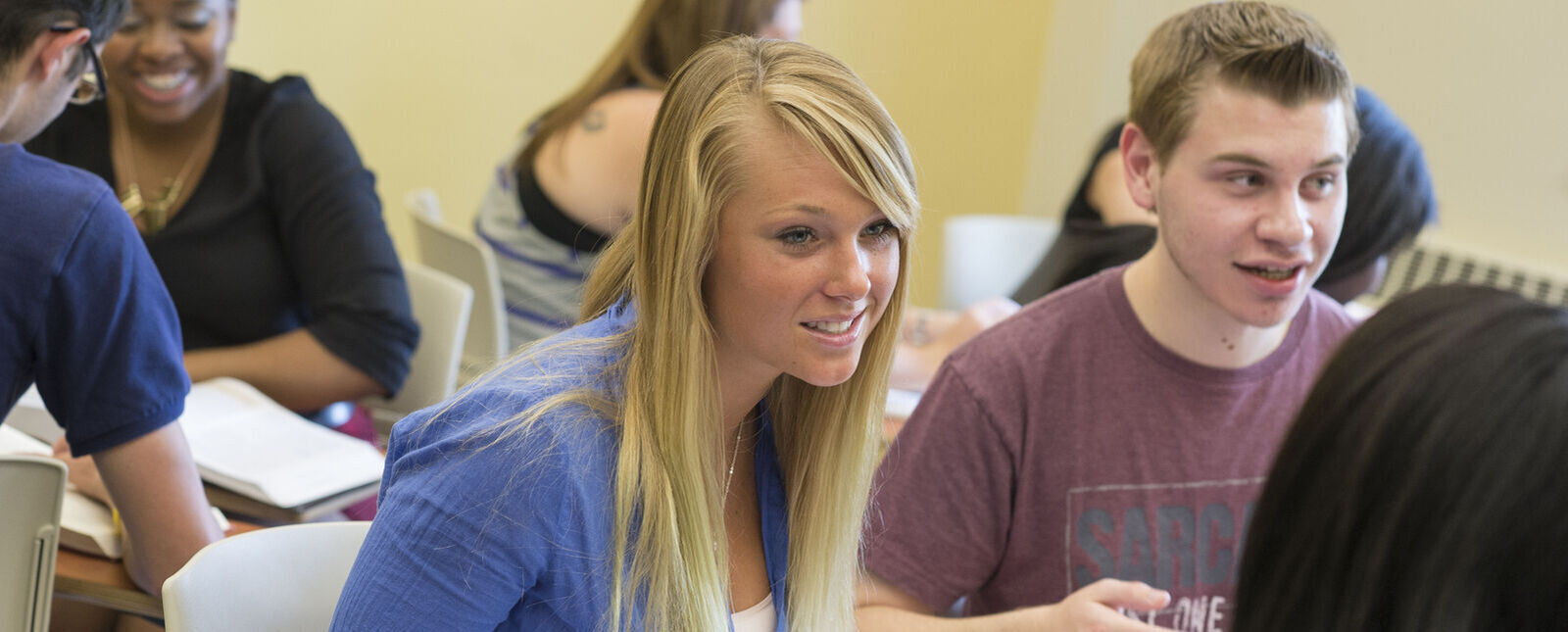 Students talk with each other during a group class activity