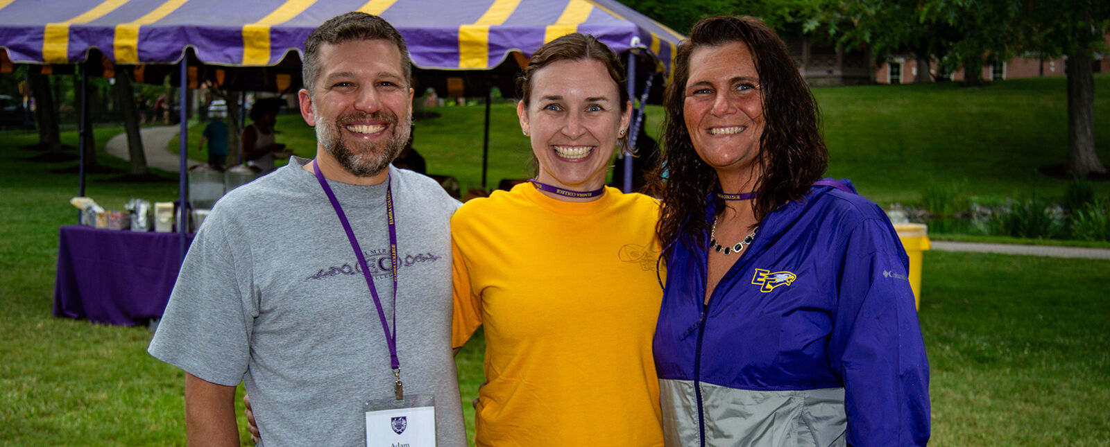 Three alumni smile together during Reunion