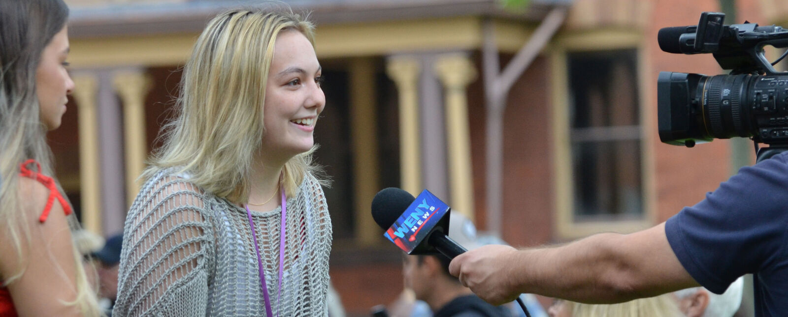 A female student is interviewed for television during Fall Welcome 2023