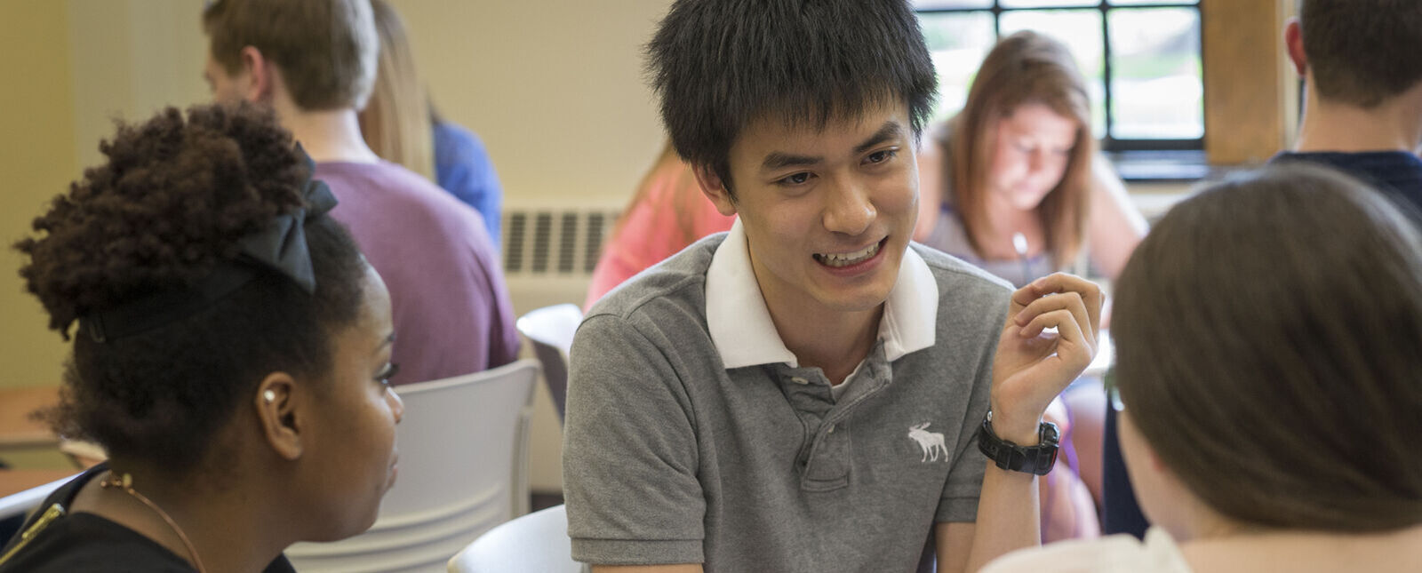 Students work in groups in a classroom