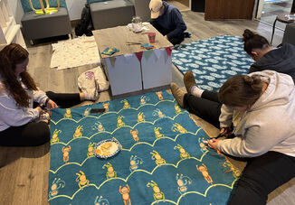 Tying Up Comfort: Elmira College Nursing Club Wraps Kids in Warmth