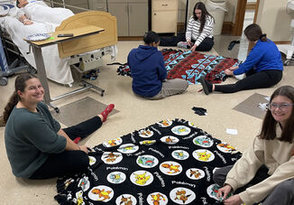 Crafting Comfort: Elmira College Nursing Club Creates Warm Gifts for Children