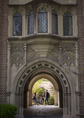Students talk in an archway in Meier Hall