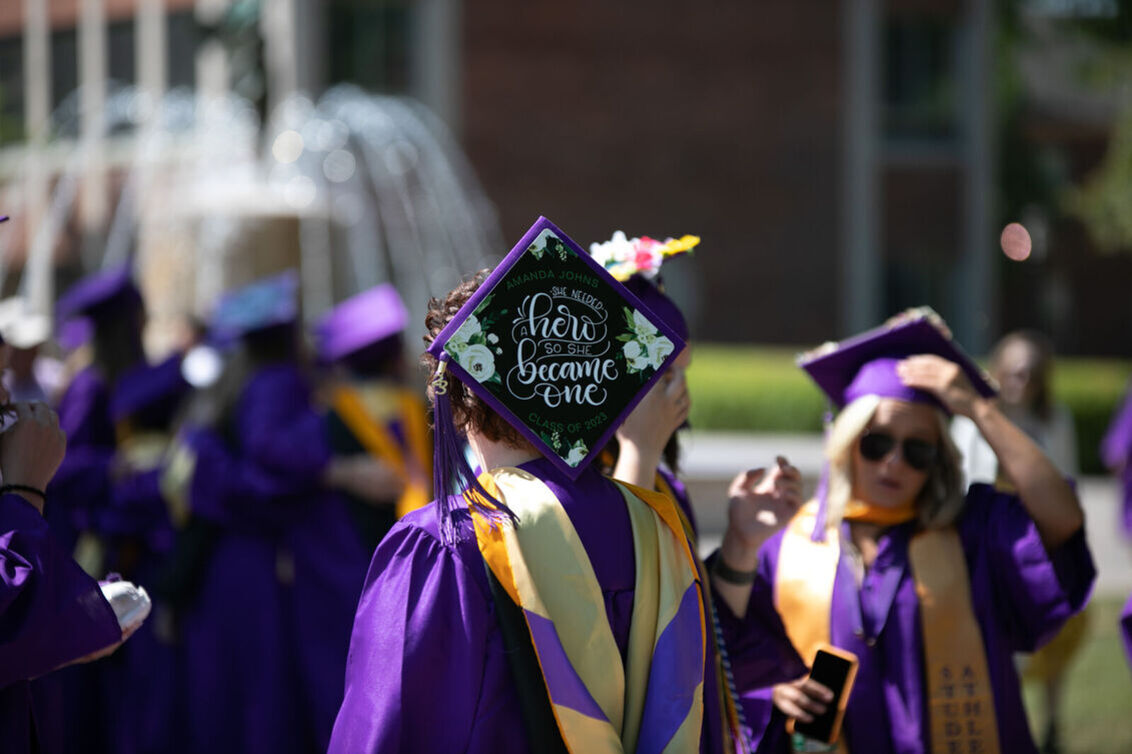 A woman's graduation cap reads: 