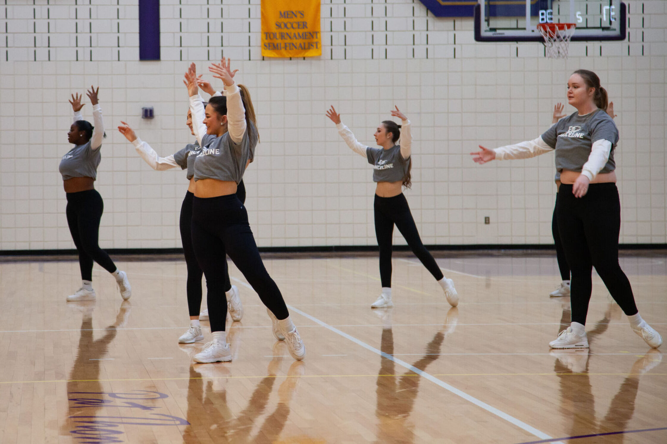 Danceline performs on the basketball court