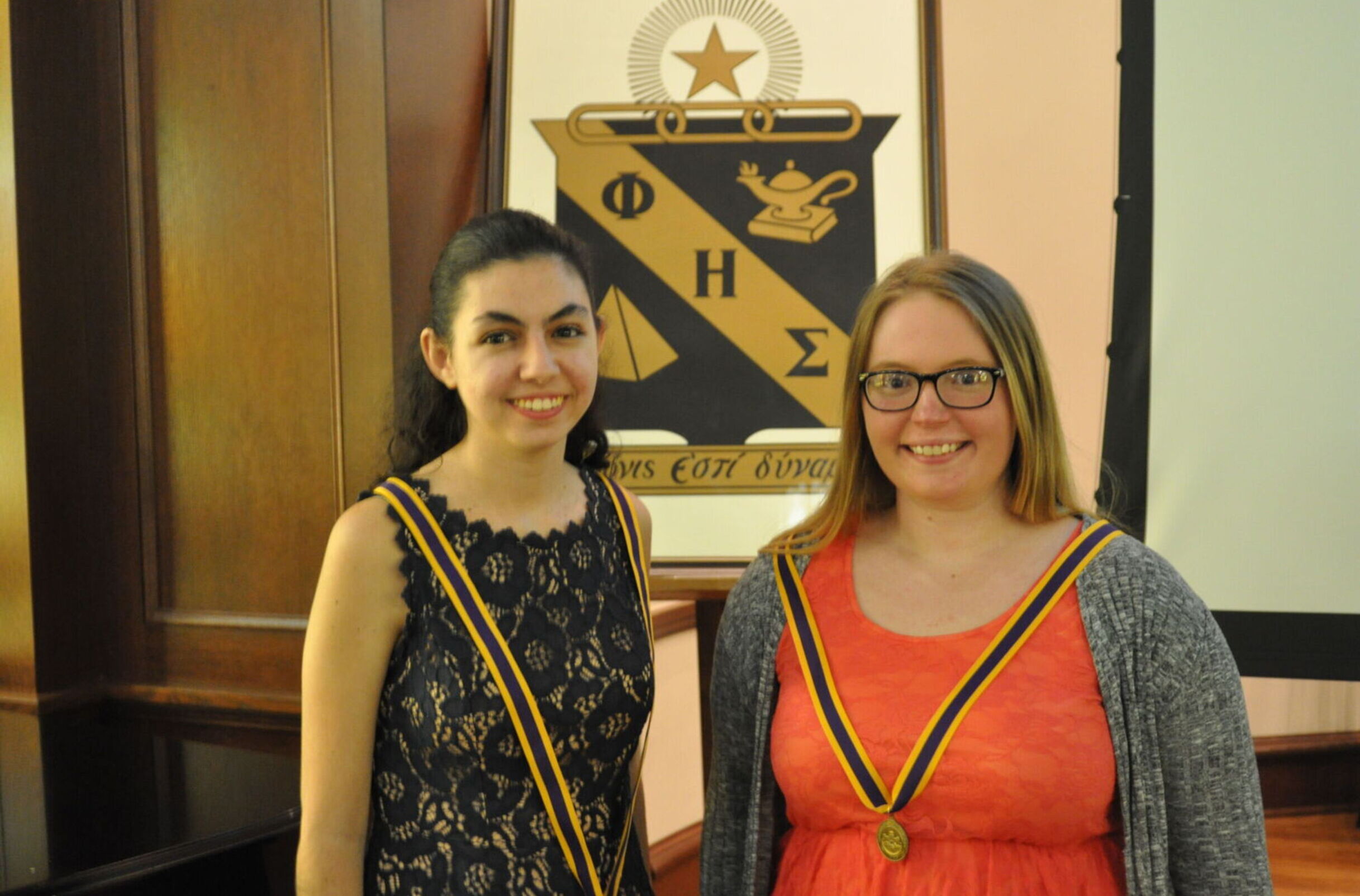 Two students during a Phi Eta Sigma ceremony