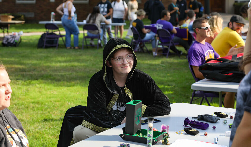 A member of the Dungeons and Dragons Club greets attendees at the Engagement Fair