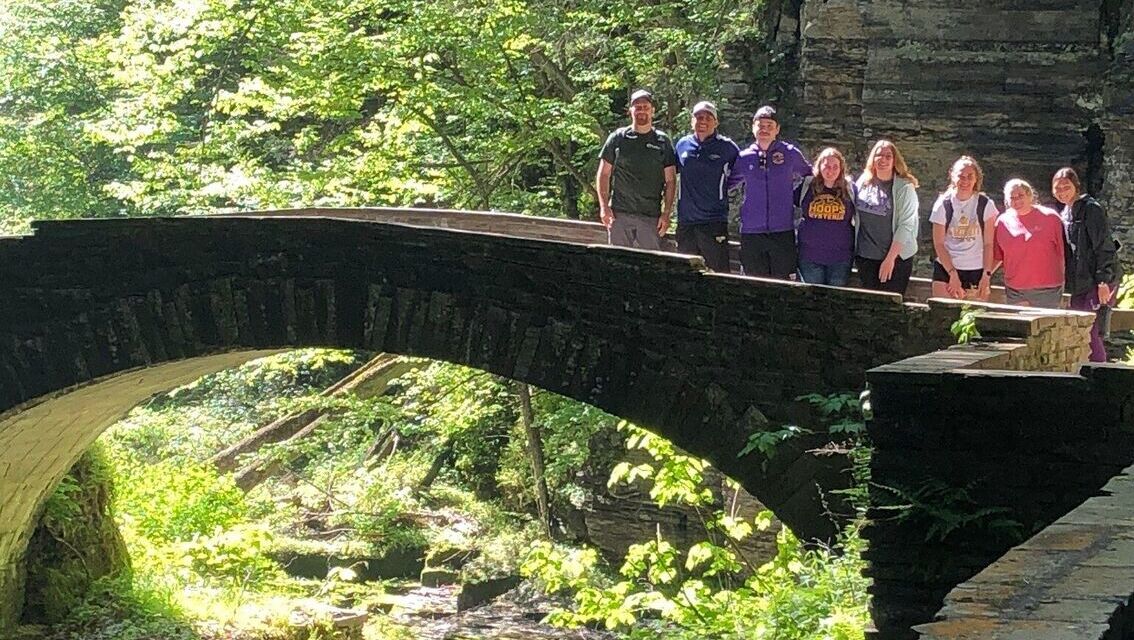 Students are pictured along a path at the Robert Treman State Park