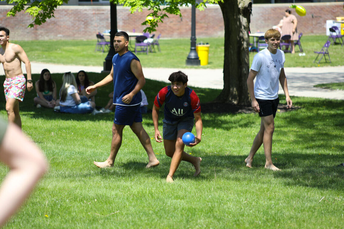 Students play water balloon dodge ball during May Days