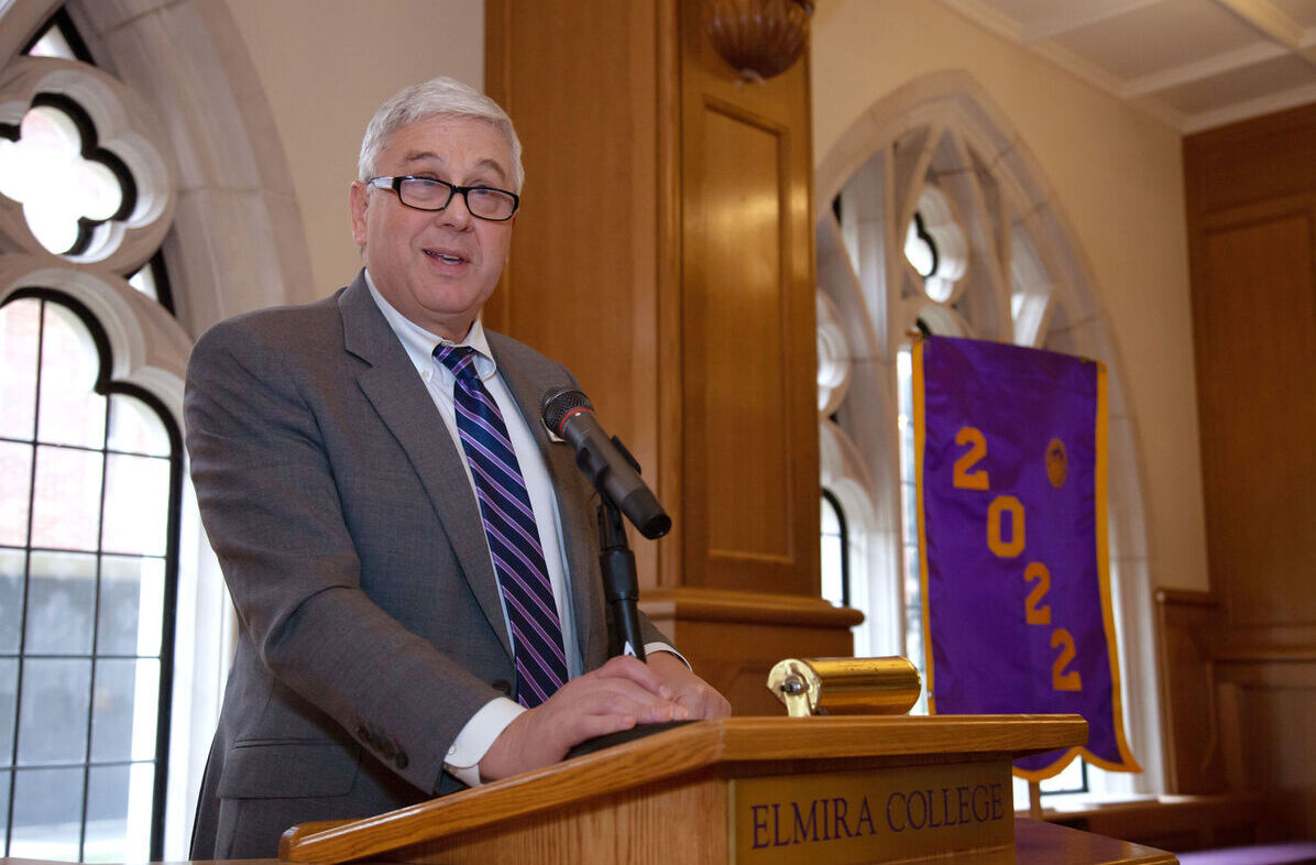 Elmira College President Charles Lindsay speaks during an alumni event
