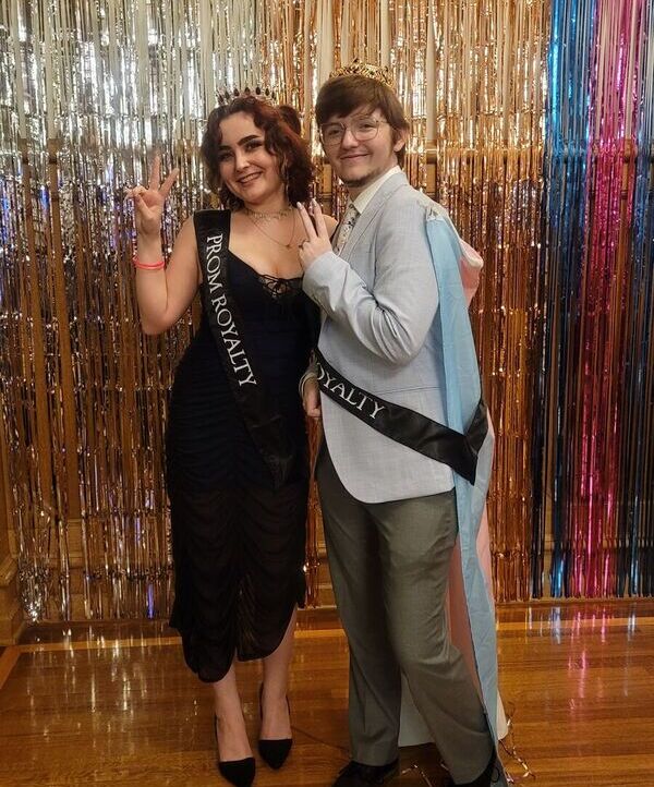 Two Pride Prom royalty members pose for a picture