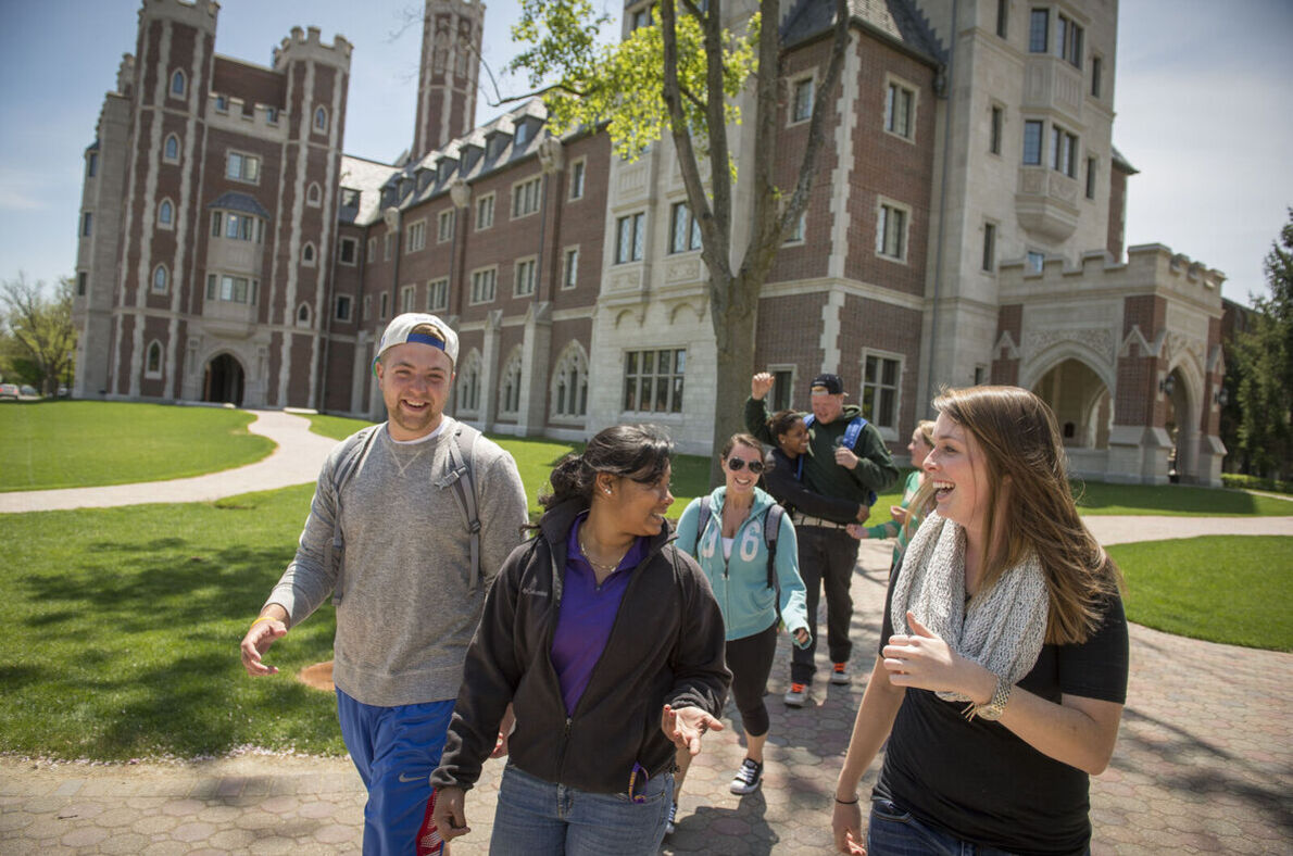 A group of students walk by Meier Hall